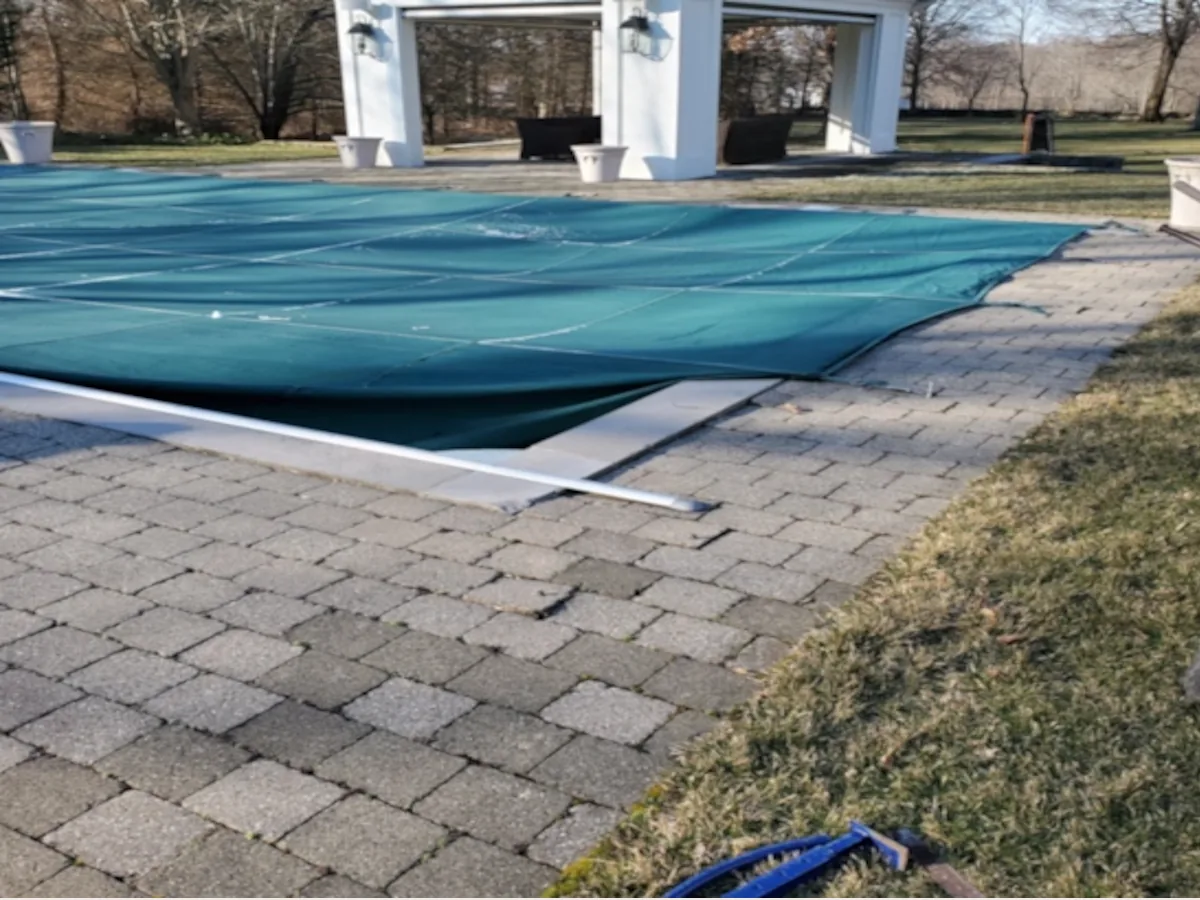 Pool coping before Three Guys Masonry renovation